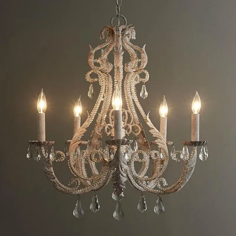 Antique white iron crystal chandelier with ornate metalwork and dangling crystals for dining room decorbites iron crystal lighting