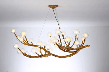 Bronze-colored antler style pendant light with branching arms and clear glass bubble led bulbs for dining room decorbites glass bubble