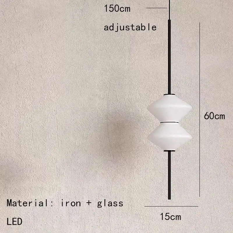 A modern art deco pendant light with white glass and a sleek black iron frame for dining room use