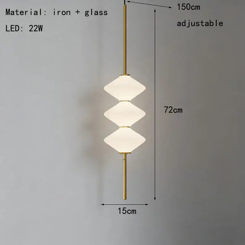 Art deco pendant light with three stacked white glass shades and brass iron frame for dining room illumination