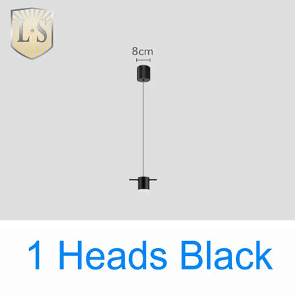 Black minimalist art deco pendant light with sleek cylindrical design and thin cord for dining room light sources