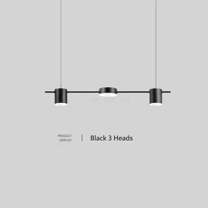 Art deco black and gold linear pendant light with three cylindrical light sources for dining room use
