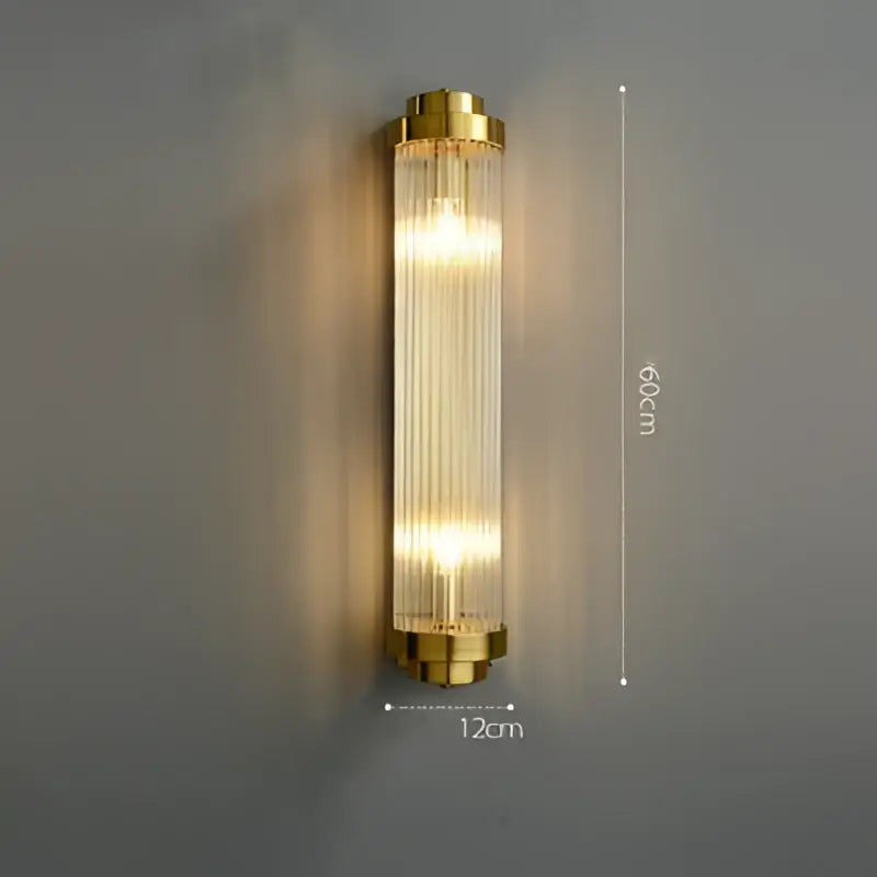 Gold-finished art deco stainless wall sconce with vertical ribbed glass prisms for bedroom decorbites lighting
