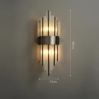 Art deco black and gold stainless wall sconce with ribbed glass rods featuring warm light for decorbites art deco use