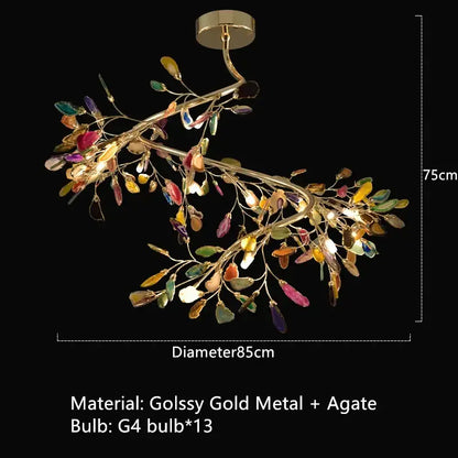 A vibrant art deco colorful agate floor lamp with gold metal arms and branch-like decorbites agate leaves