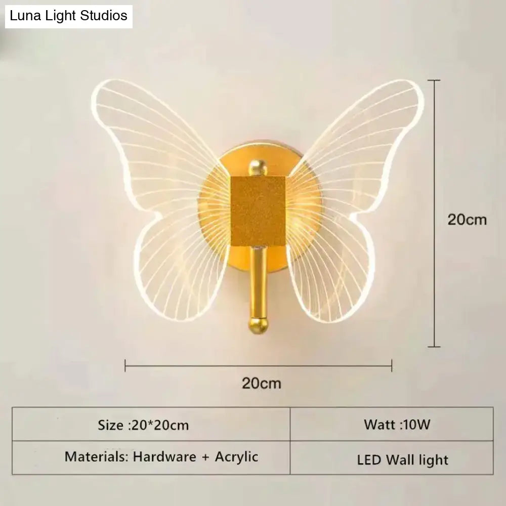 Art deco gold butterfly wall lamp with translucent acrylic wings and metallic base for bedroom bedside wall use