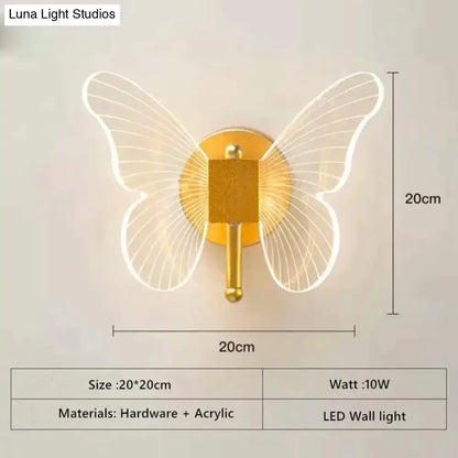 Gold-toned butterfly-shaped led wall lamp with translucent acrylic wings for bedroom bedside wall lighting