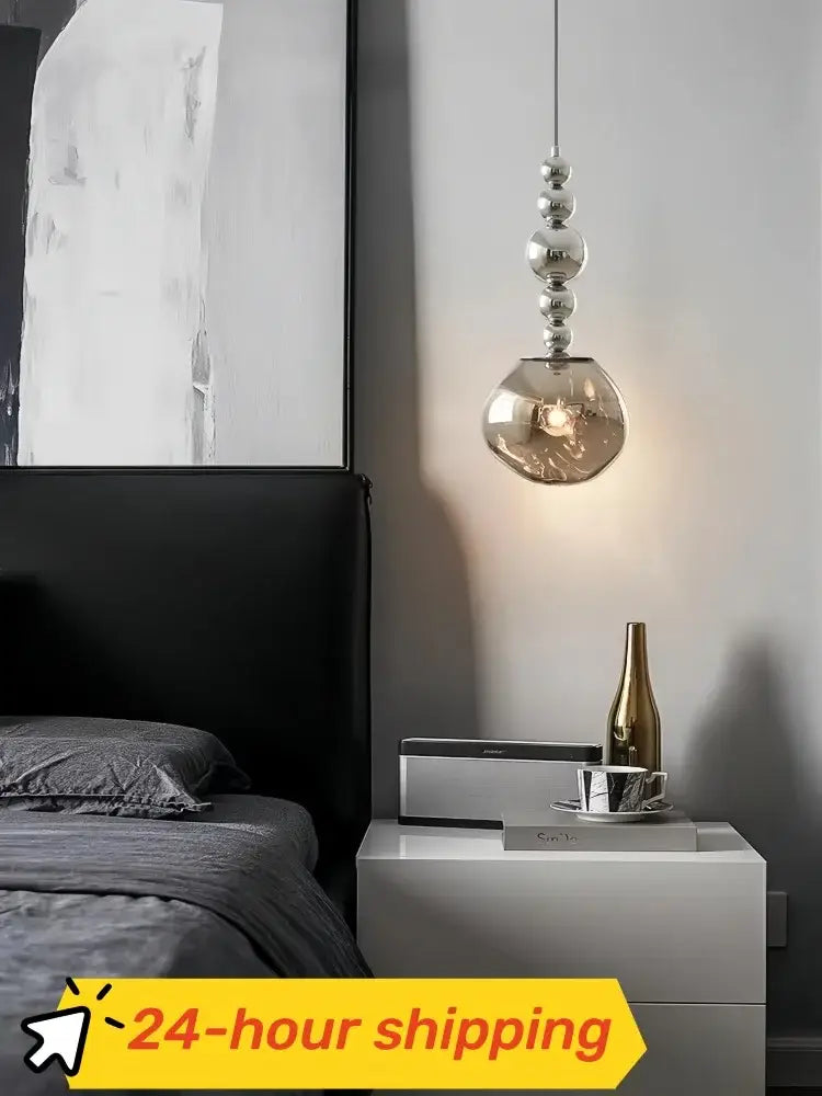 Art deco silver lava pendant light with a sleek spherical glass shade and polished metallic beads for living room with led bulb