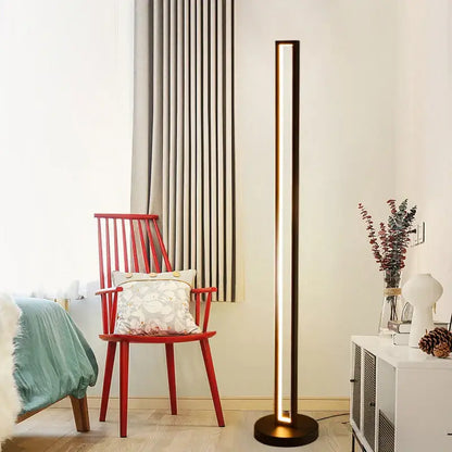 Modern minimalist floor lamp with sleek dark metallic finish and vertical light strip for art deco decorbites ambient lighting