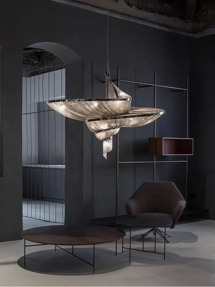 A modern art deco vintage black pendant light with metallic frame and cascading glass elements for dining room decorbites