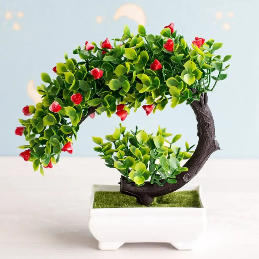 Artificial bonsai tree with vibrant green leaves and bright red blossoms crafted from realistic artificial materials