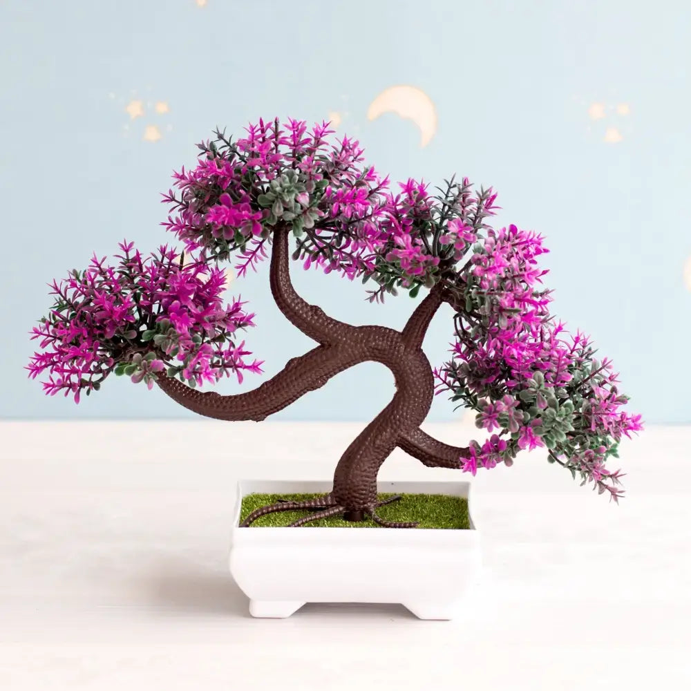 Artificial bonsai tree with vibrant purple flowers, textured brown trunk, green foliage in a white rectangular pot for decor