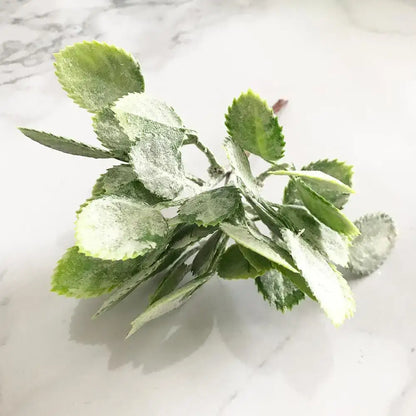 Frosted green artificial foliage with delicate leaf shapes in a decorbites green plant flower cherry bundle for living room decor