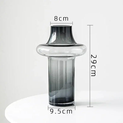Artisan glass vase with a sleek modern design featuring clear to dark gray gradient and an elegant flared neck