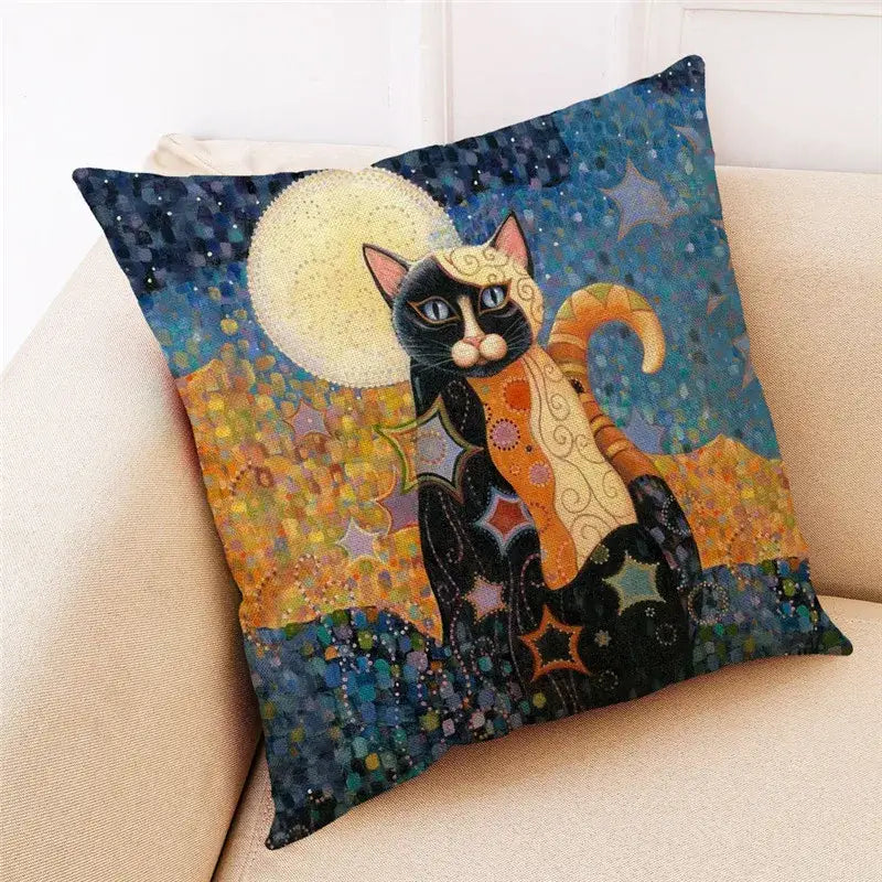 Square throw pillow featuring a stylized black cat print with orange accents on a starry night sky for decorbites cat print decor