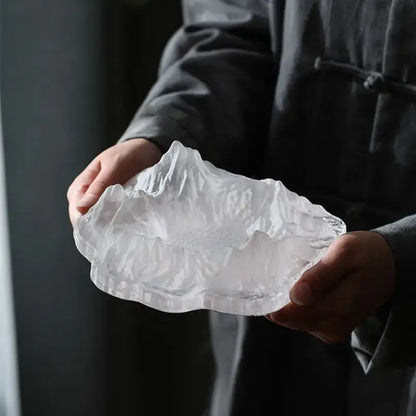 Artistic clear and gold decorbites iceberg glass dessert plate featuring a transparent intricately carved mountain design