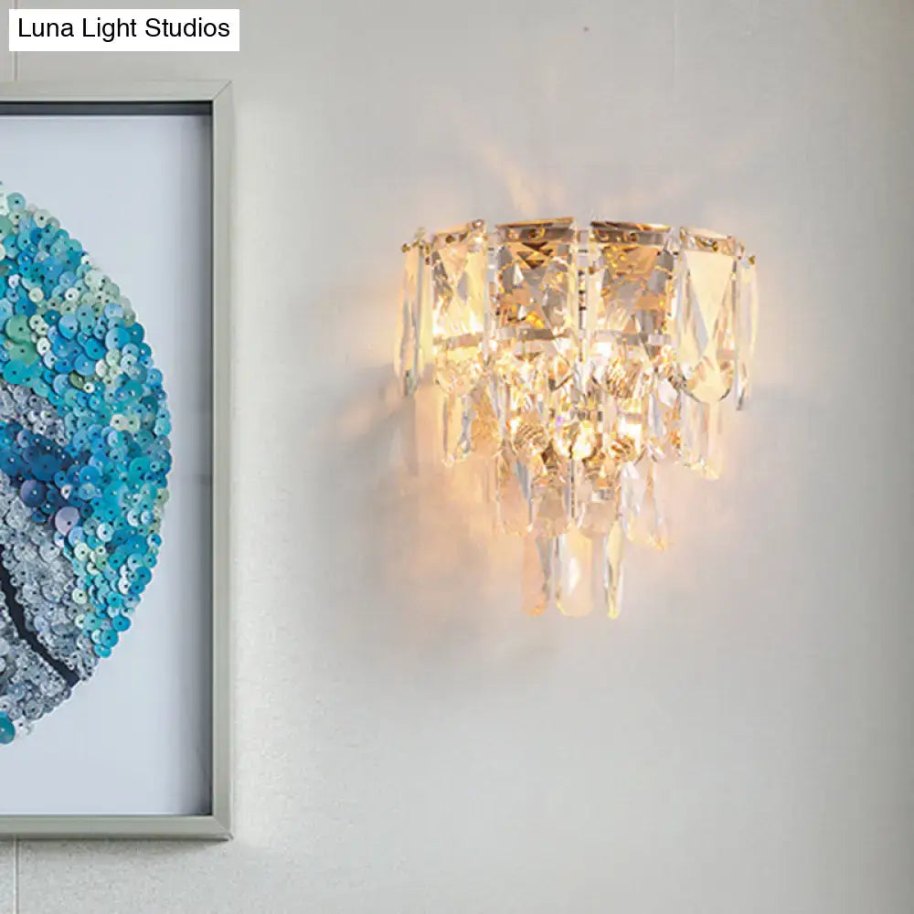 Artistic gold crystal tiered wall lamp featuring faceted clear glass prisms for elegant living room wall light