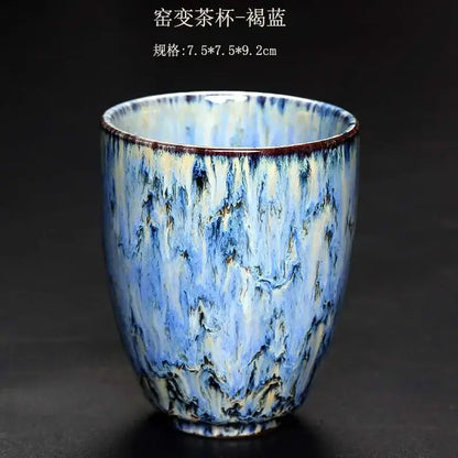 A ceramic tea cup with swirling blue and white crackle glaze and brown rim accents from decorbites ceramic kung fu tea set
