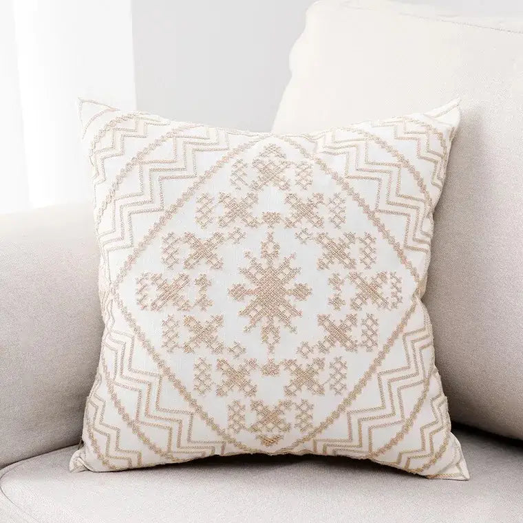 Cream-colored aztec embroidery canvas cushion cover with intricate beige embroidered geometric patterns for living room use