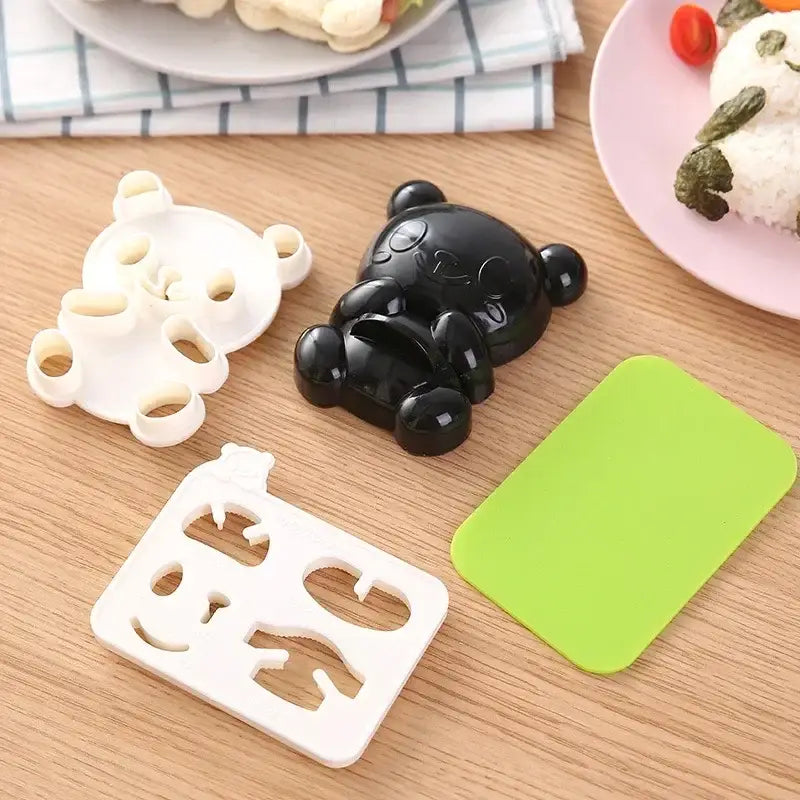 Black plastic bear-shaped rice mold from baby panda sushi mold and sandwich cutter set for kitchen diy use