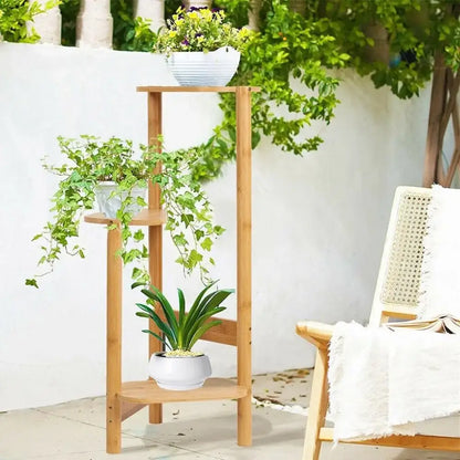 Light brown bamboo corner plant stand with three tiered shelves by decorbites for garden balcony use