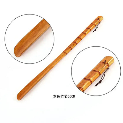 A 55cm natural bamboo pattern long handle shoe lifter with smooth light brown finish and segmented design