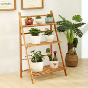 DecorBites™ bamboo plant stand organizer shelf in light brown wood with three tiers holding potted plants indoors and outdoors