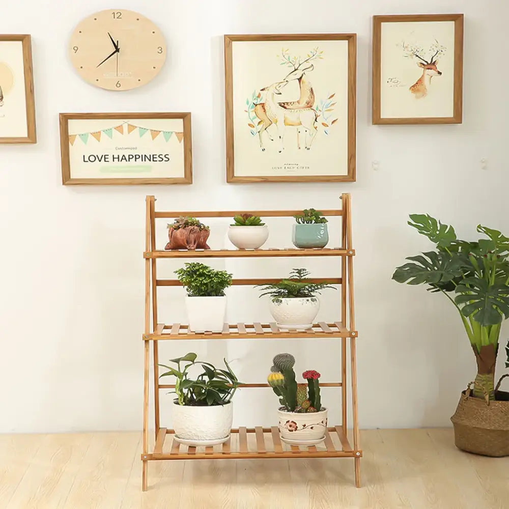 Decorbites™ bamboo plant stand organizer shelf with three-tier light wood slatted shelves holding potted plants