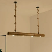 A rustic bamboo tube island pendant light with natural tan finish and beige rope featuring three led bulbs by decorbites