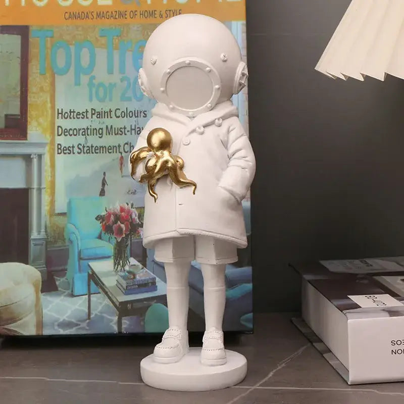Banksy deep diver black and white resin sculpture of a white astronaut figurine holding a golden octopus for decor