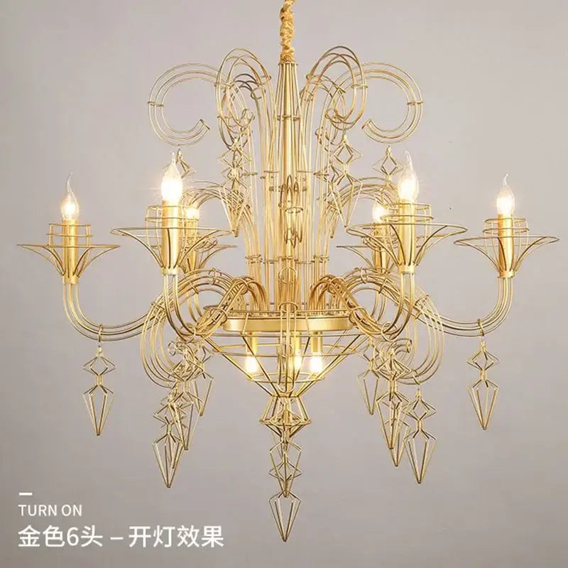 Golden metal chandelier with intricate geometric floral wirework and six lit bulbs for decorbites baroque black candle chandelier