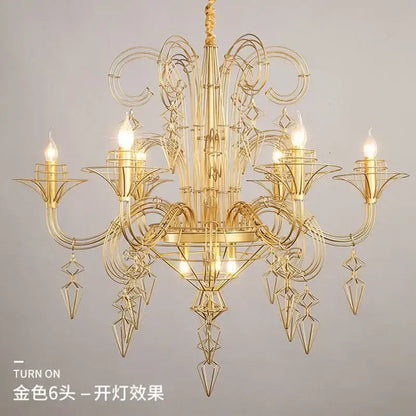 Golden metal chandelier with intricate geometric floral wirework and six lit bulbs for decorbites baroque black candle chandelier