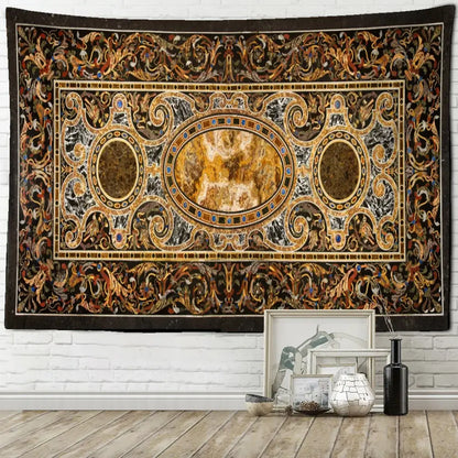 An ornate rectangular baroque black and gold style astrology tapestry wall hanging on a white brick wall