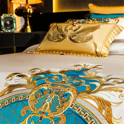 Luxurious cream satin cotton bedding set with gold and turquoise baroque embroidery showcasing ornate floral motifs