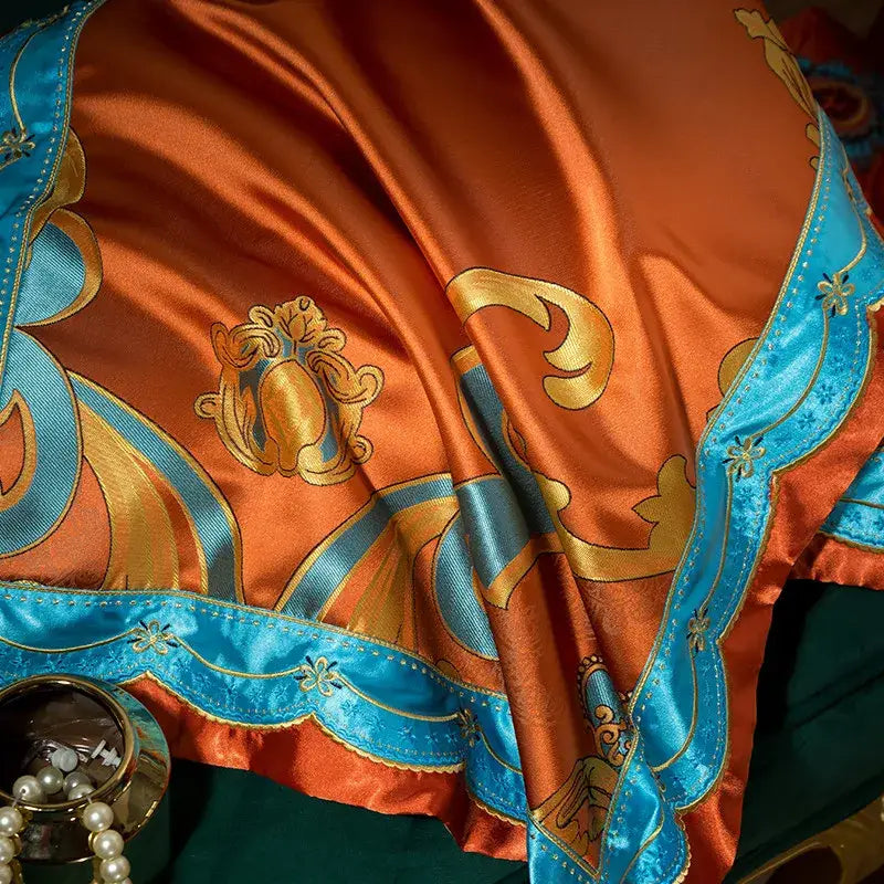 Orchid-colored satin fabric with gold and turquoise embroidery along scalloped edge in 200s embroidery cotton bedding set