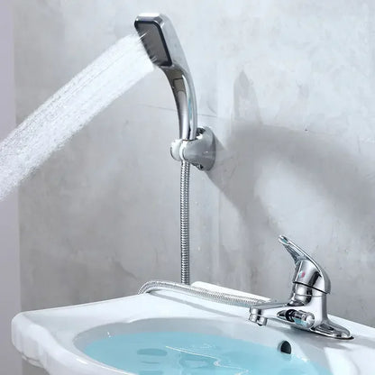 Chrome finished deck mounted handheld showerhead with flexible metal hose attached to wall bracket for bathroom use