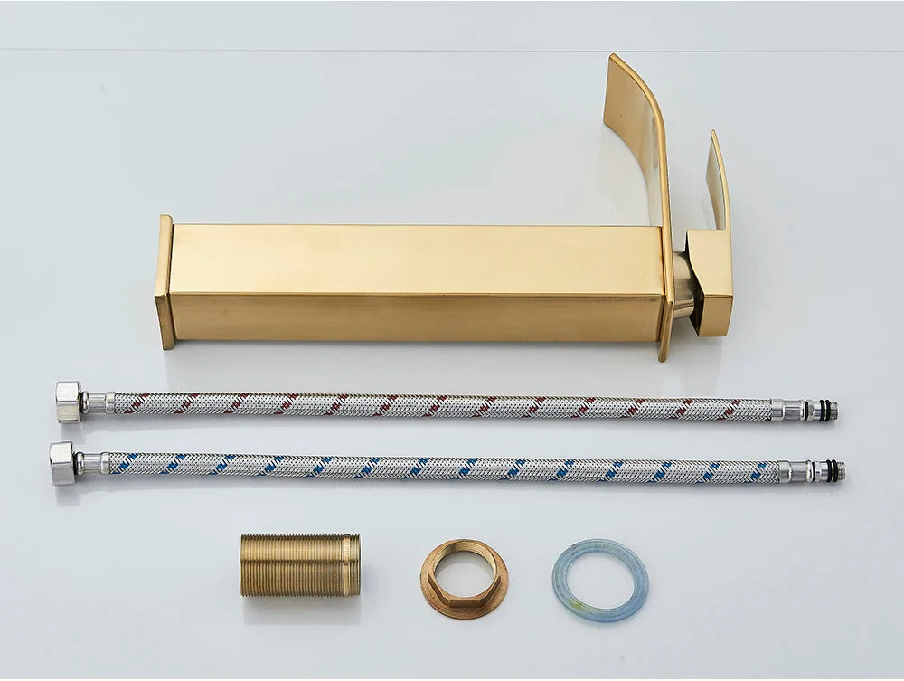 Gold-colored bathroom sink faucet brass deck mount with sleek rectangular spout and stainless steel handle
