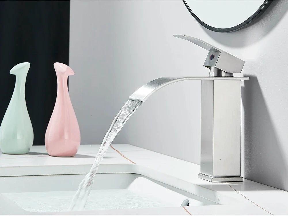 Modern bathroom sink faucet brass deck mount with brushed stainless steel finish and sleek waterfall spout design