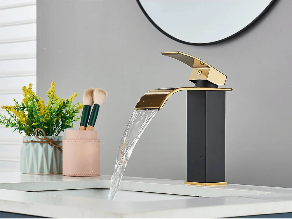 Modern bathroom sink faucet brass deck mount with sleek black and gold stainless steel waterfall curved spout design