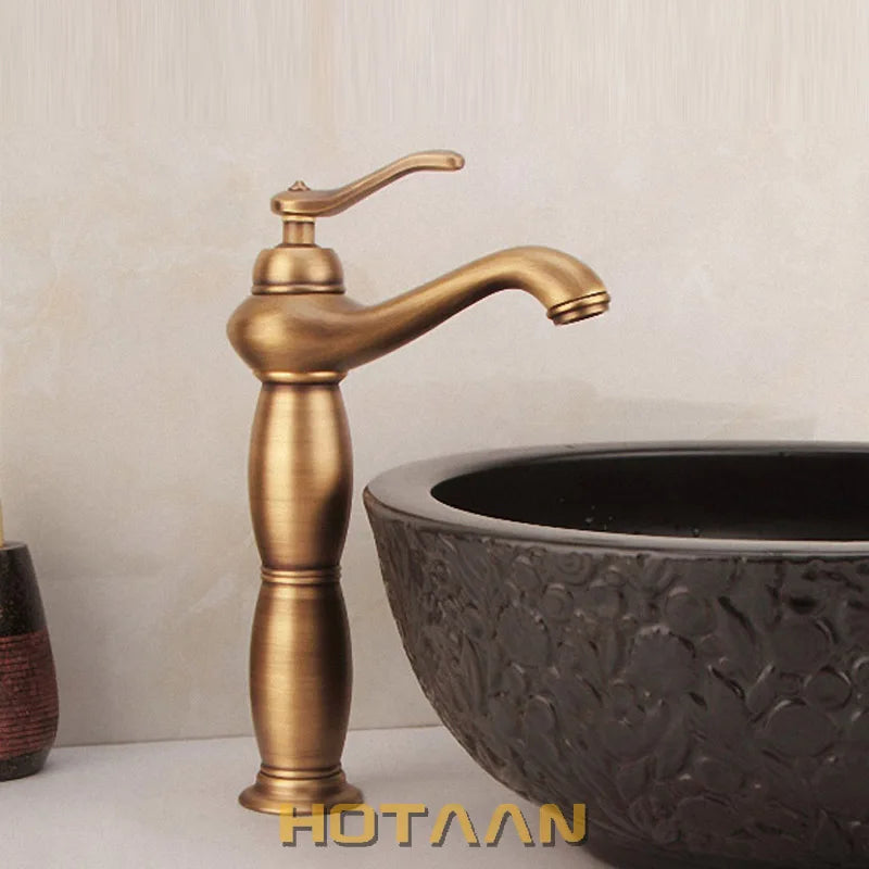 Antique brass-finished tall basin bathroom faucet with single handle curved spout and ornate cylindrical base