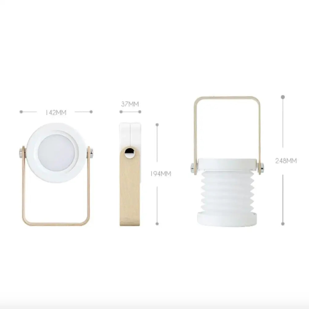 White collapsible battery-operated wall sconce lantern with gold-toned metal frame and handle for indoor use