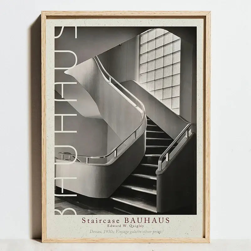 A framed black and white bauhaus movement geometric art print featuring a modernist staircase and vertical bauhaus lettering