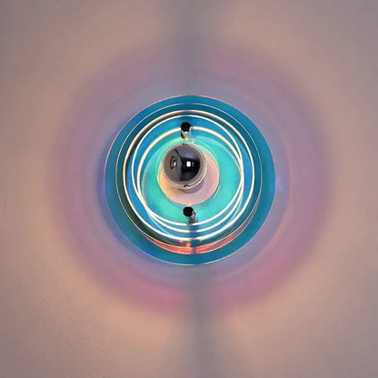 Bauhaus green and clear glass led wall sconces with circular blue and white layers and central black bulb decorbites led wall light