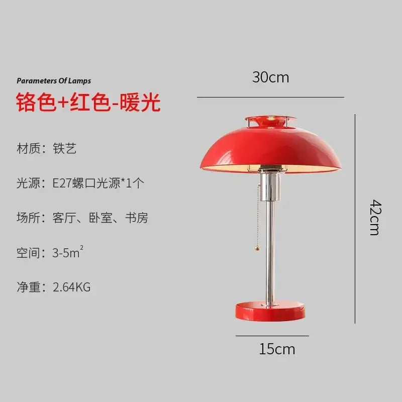 A vibrant red bauhaus led table lamp with glossy dome shade and chrome base for bedroom or living room use