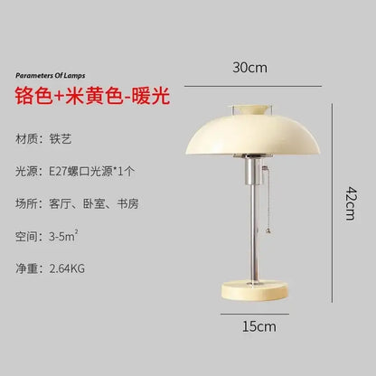 Cream-colored dome-shaped lampshade with chrome metal base on bauhaus led table lamp in glossy red for bedroom or living room