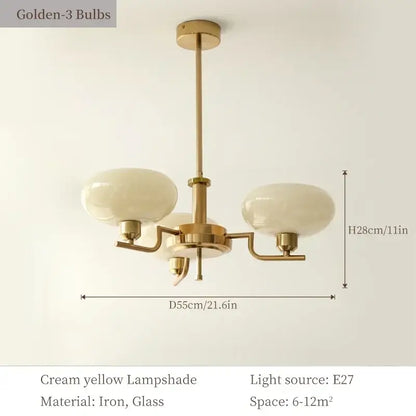 A bauhaus medieval chandelier with brass finish, three cream yellow glass lampshades made of iron and glass for living room light