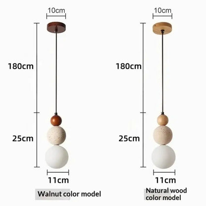 Two 180cm hanging pendant lights with wooden mounts and walnut spherical shades feature travertine stone and work beautifully