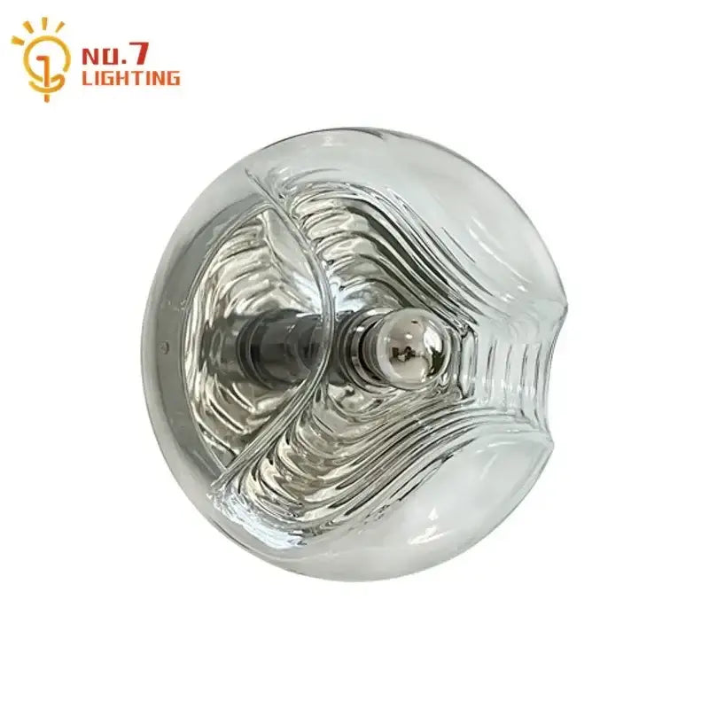 Clear bauhaus wavy glass wall lamp with metallic wave pattern and central bulb for bedroom lighting