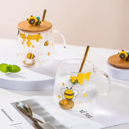 Bee glass spoon milk cups with clear glass, yellow bee decals, bamboo lids, and golden spoons for kitchen coffee use