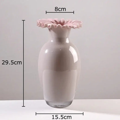 A sleek blush-pink ceramic vase with a pink flower edge rim and clear glass base for living room decor